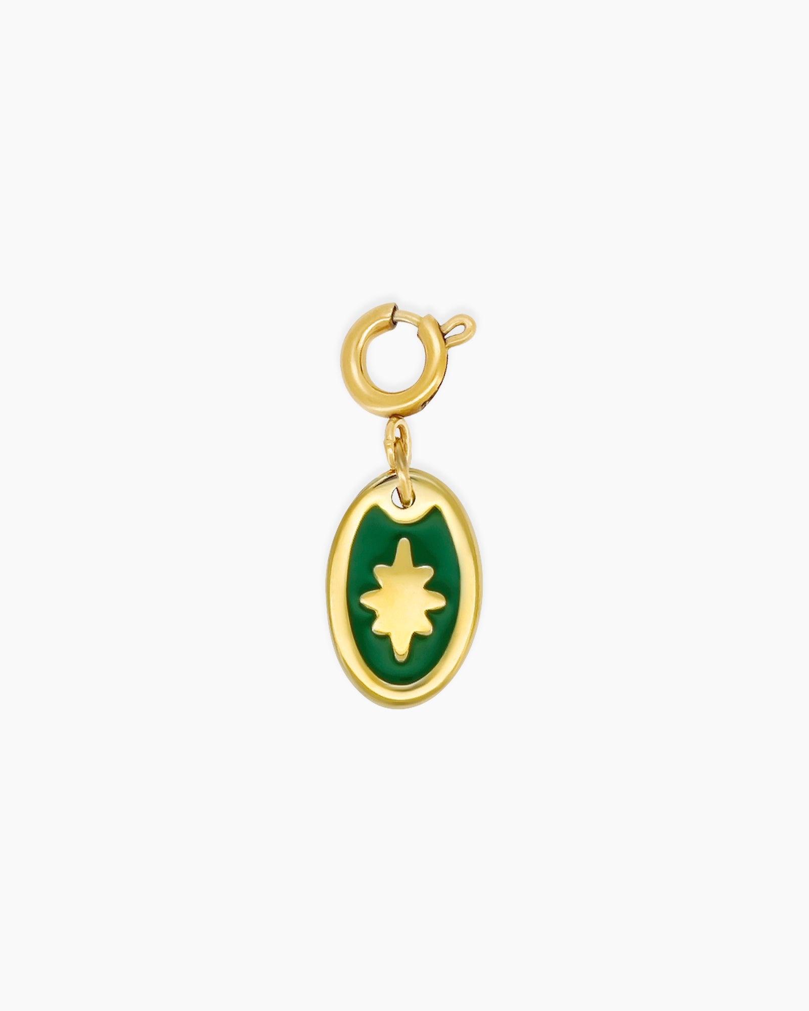 An oval pendant with a glossy green enamel inlay and a radiant golden starburst