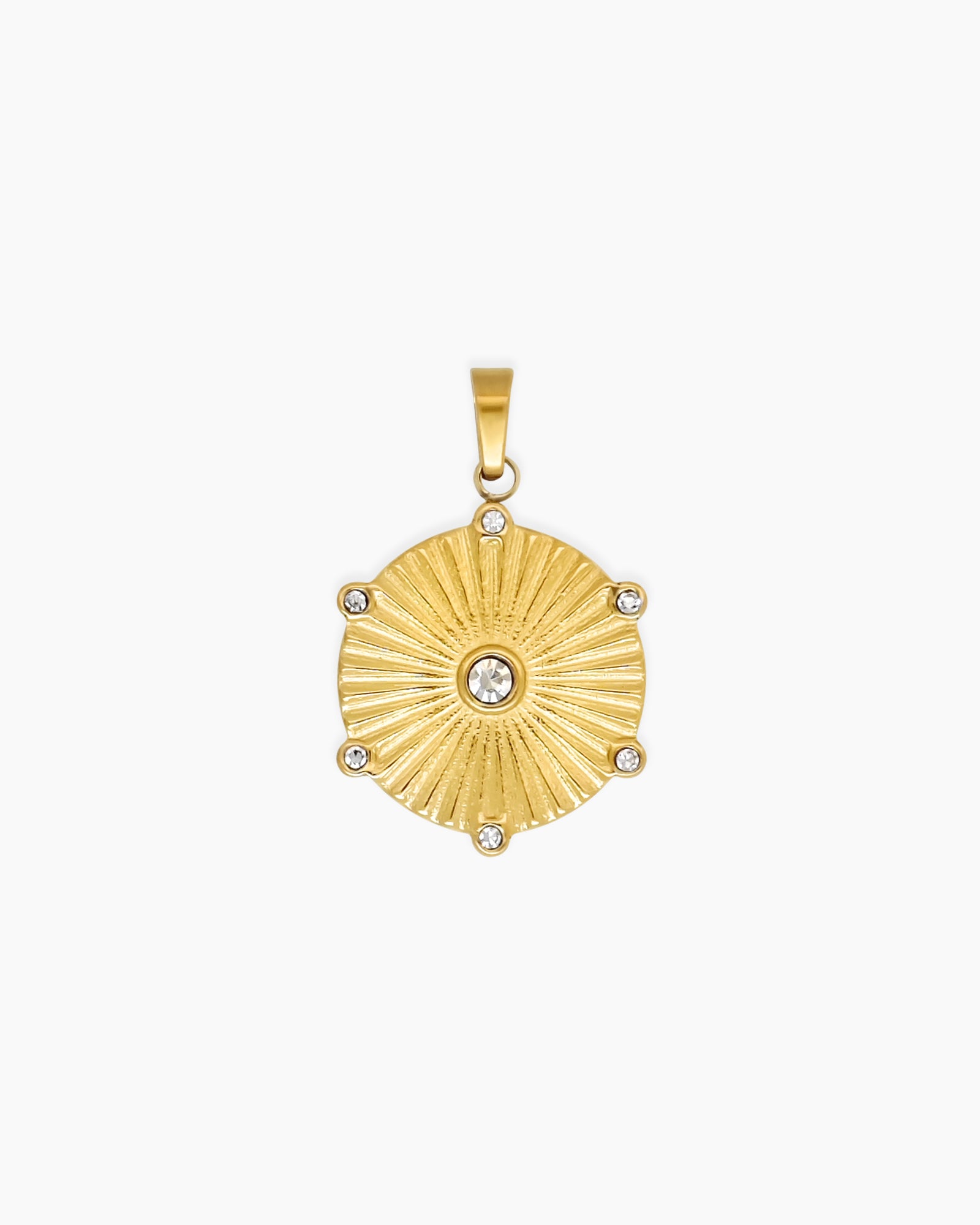 A pendant with a star-like silhouette, fine ridged detailing, and a central clear crystal