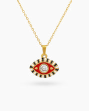 A modern talisman necklace with an eye-shaped pendant in vivid red-white enamel and a vibrant rhinestone