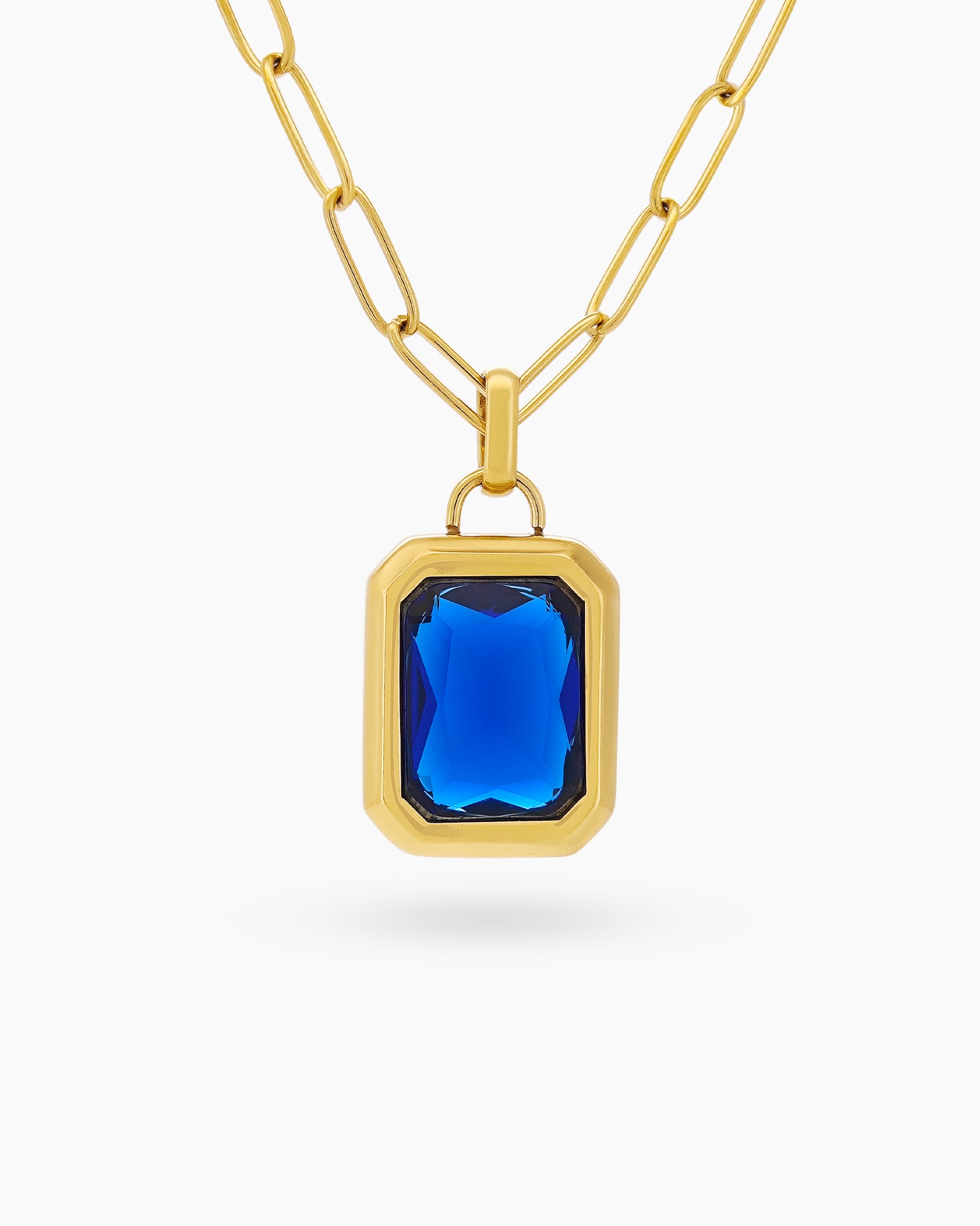 A necklace with a large, emerald-cut white zircon stone in a sleek bezel on a paperclip chain