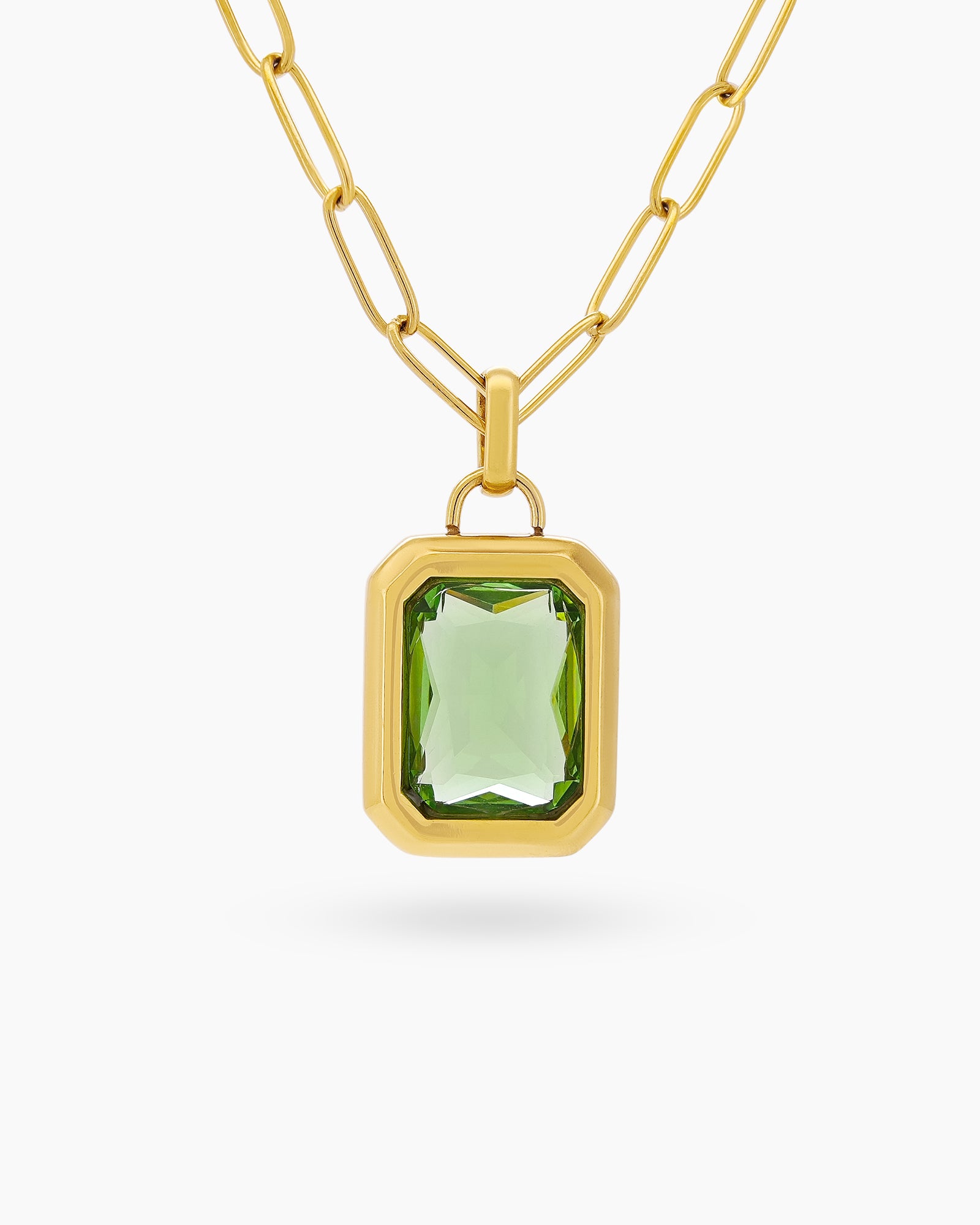 A necklace with a large, emerald-cut blue zircon stone in a sleek bezel on a paperclip chain