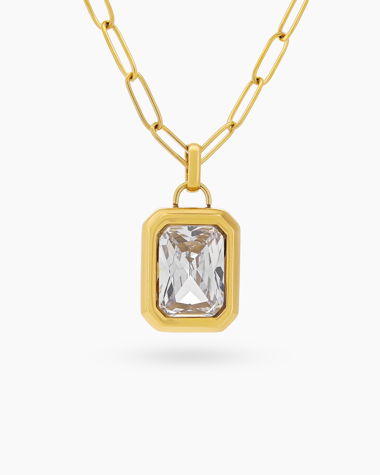 A necklace with a large, emerald-cut white zircon stone in a sleek bezel on a paperclip chain