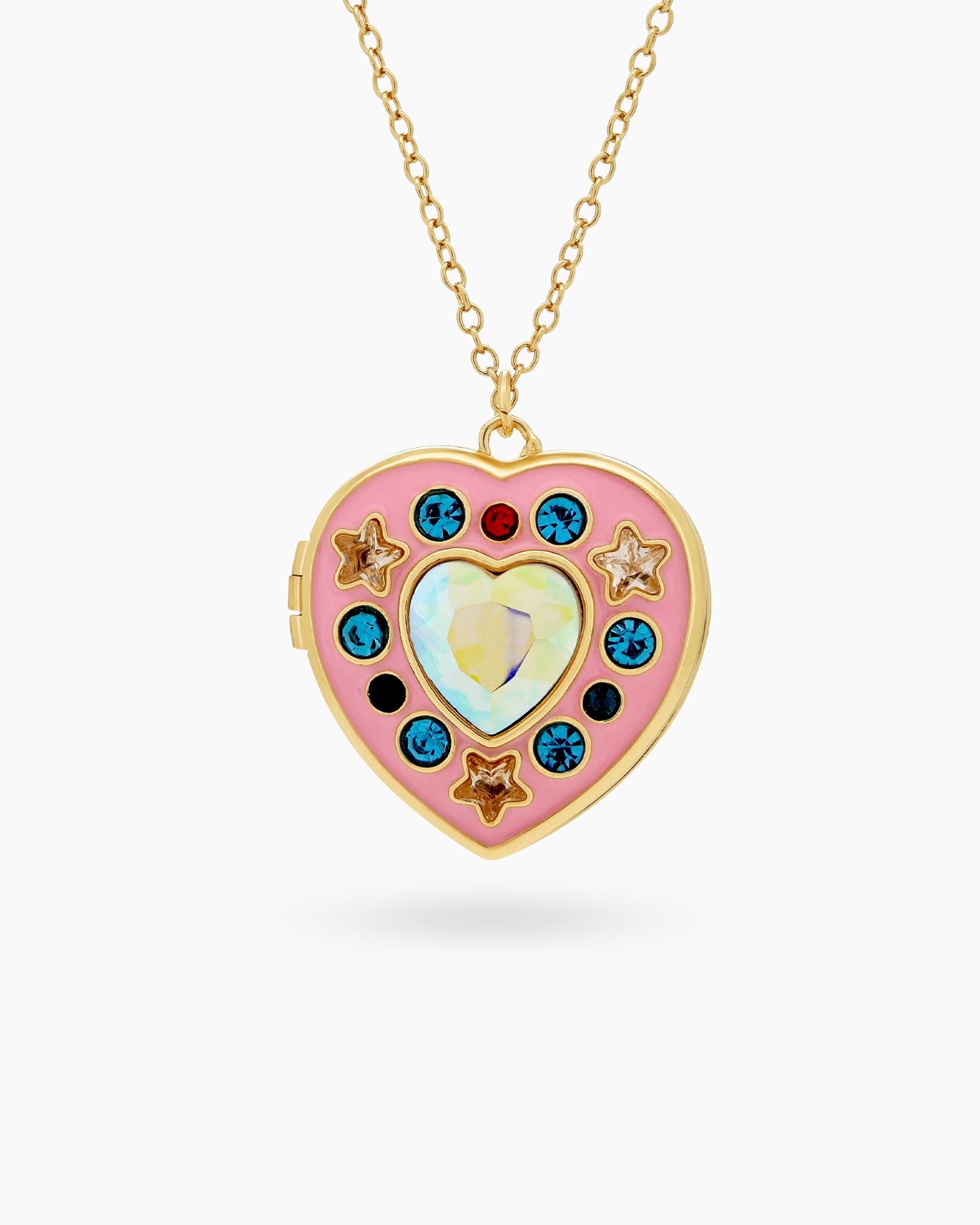 A gold-toned locket with a pink enamel heart, adorned with colorful zircons and golden star details
