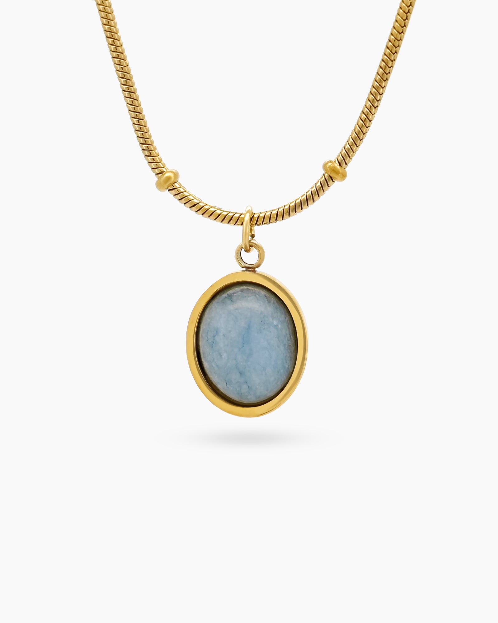A necklace with an oval-cut cat eye stone on a vintage-inspired satellite chain for a romantic look