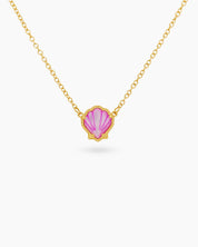 A pink necklace with a hand-engraved resin shell pendant in a fine gold-tone bezel on a dainty chain
