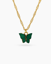 A fine gold-toned chain necklace with a modern butterfly pendant carved from glossy green resin
