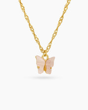 A fine gold-toned chain necklace with a modern butterfly pendant carved from glossy light-pink resin