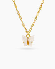 A fine gold-toned chain necklace with a modern butterfly pendant carved from glossy white resin