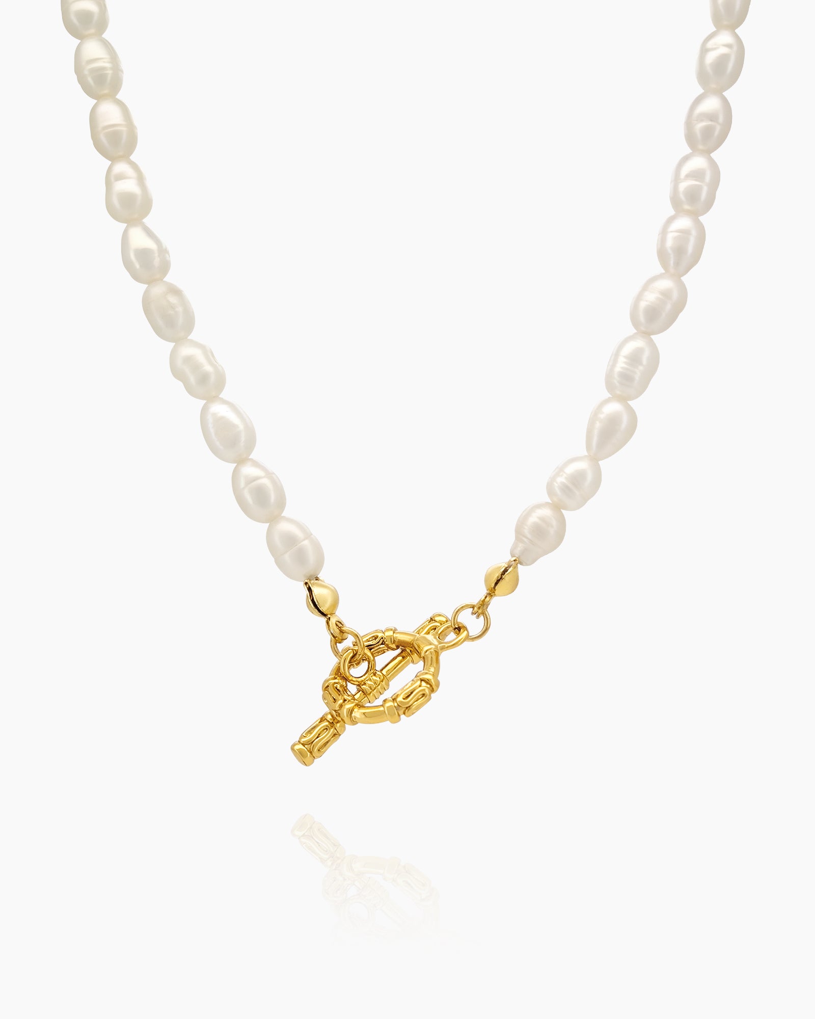 A necklace of lustrous freshwater pearls strung in a graceful silhouette with a gleaming gold toggle clasp