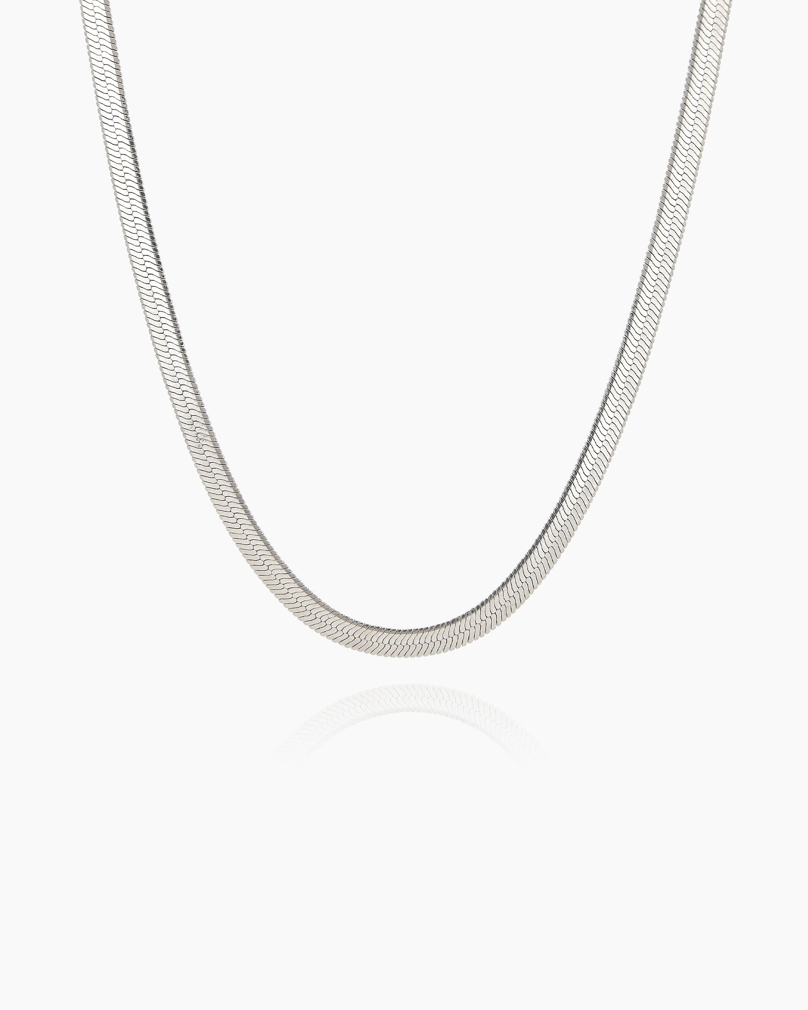 A smooth, flat silver snake chain necklace with an ultra-polished finish for a modern, sleek look