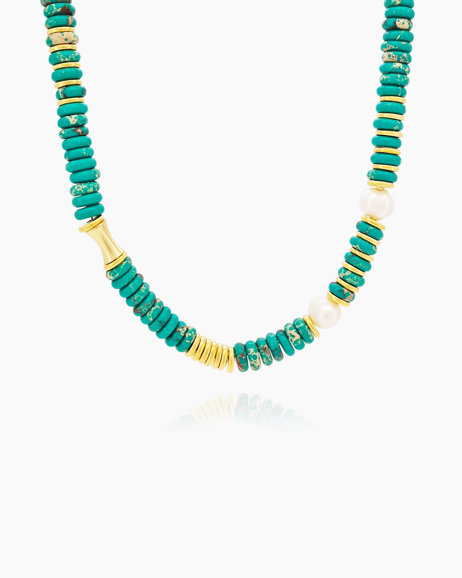 A necklace of stacked turquoise-toned beads with golden accents and luminous pearl-like details