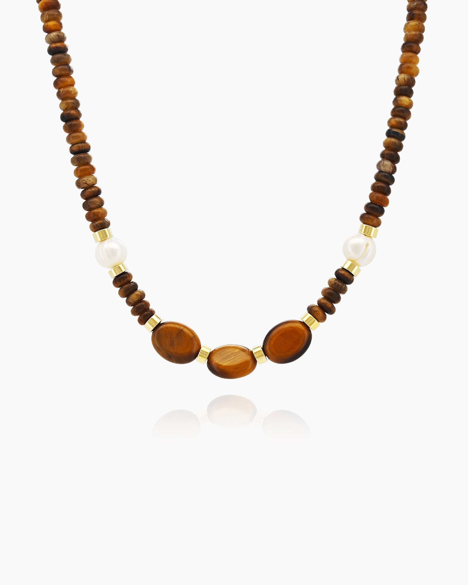 A necklace of natural bamboo stones in rich caramel and chocolate hues with creamy white and golden spacers