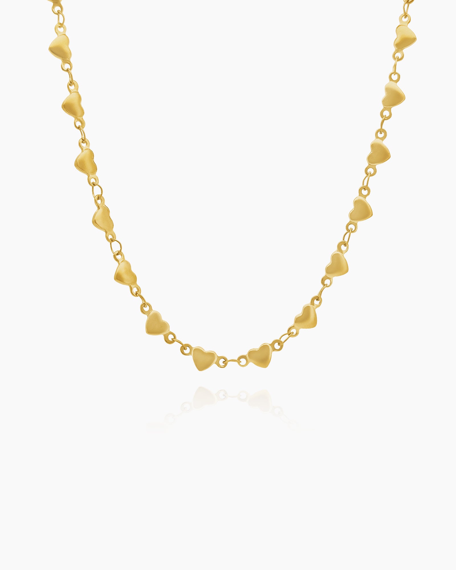 A necklace with a delicate strand of tiny gold-tone hearts linked together for a whisper of shine