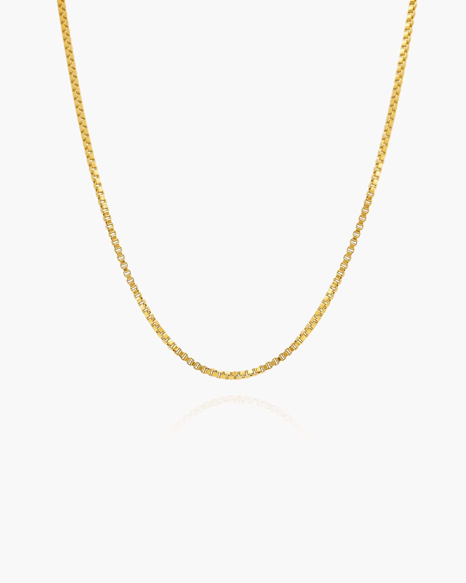 A timeless staple necklace with sleek, geometric links that reflect light for a polished look