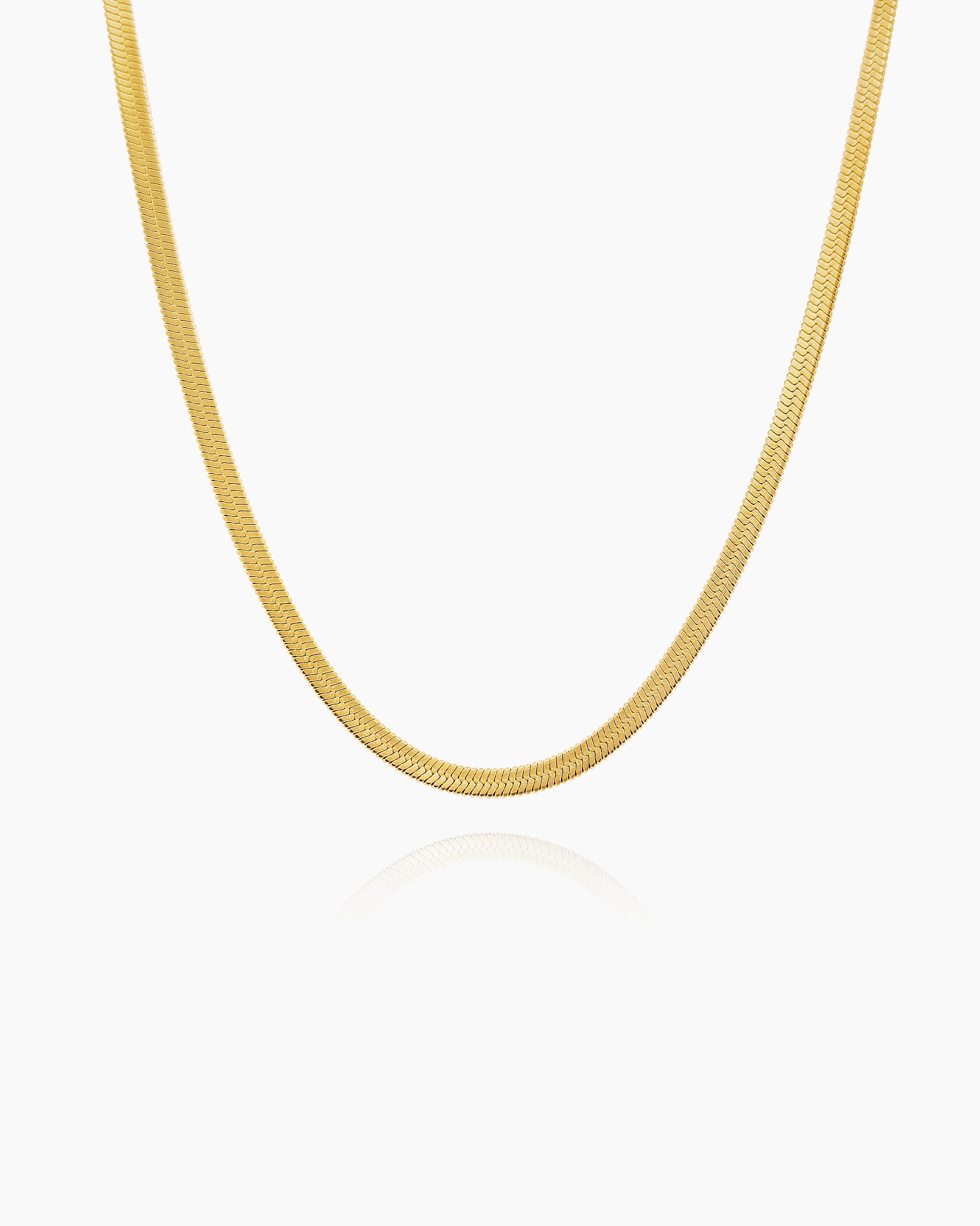 A slim gold-tone snake chain necklace in a choker-length fit for a crisp, modern feel