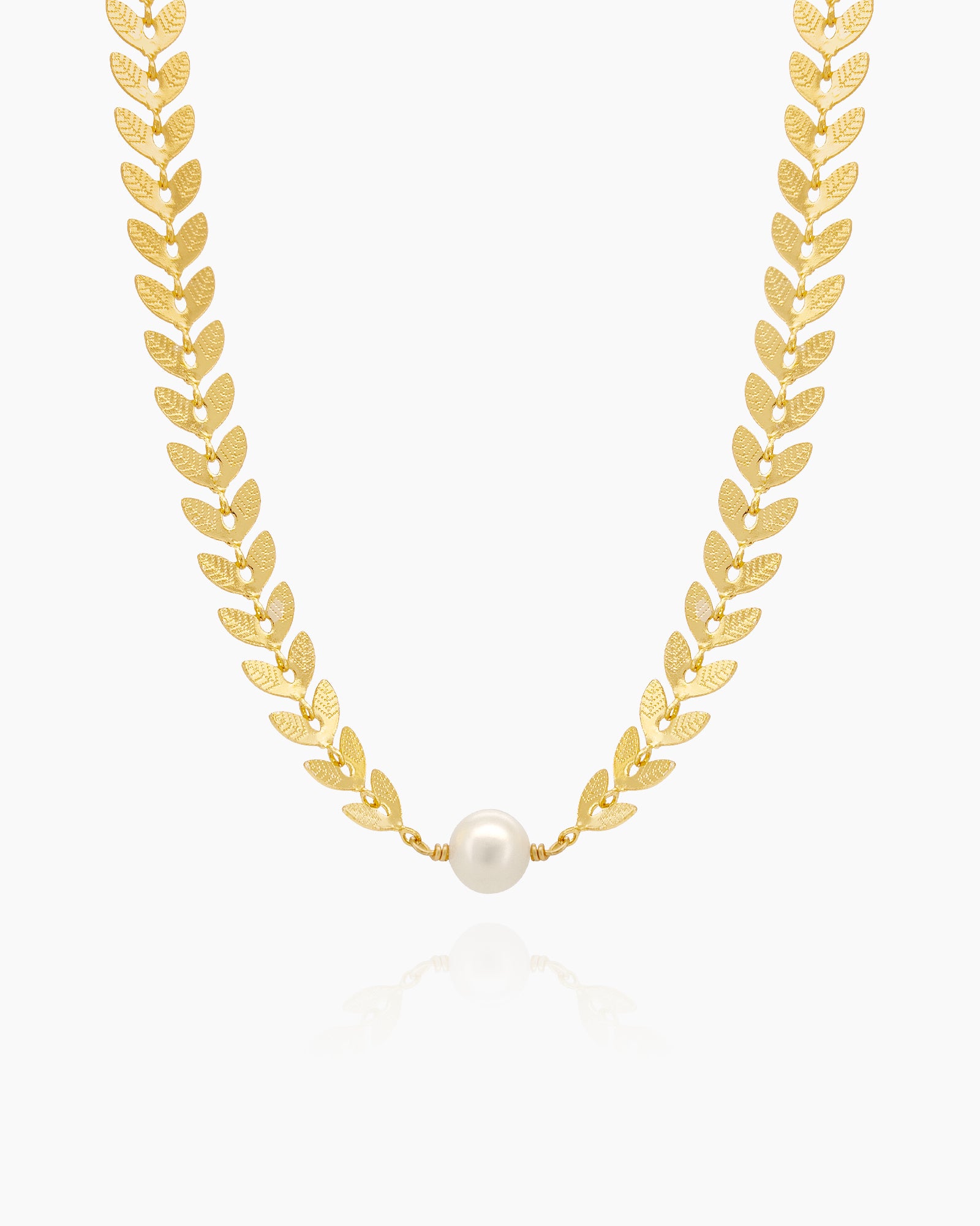 A choker of fine laurel leaves in a graceful silhouette, accented with lustrous pearls
