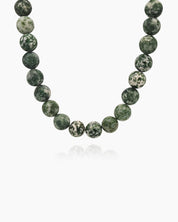 A hand-strung necklace of natural green jasper beads with soft, marbled tones for a grounded, elegant look