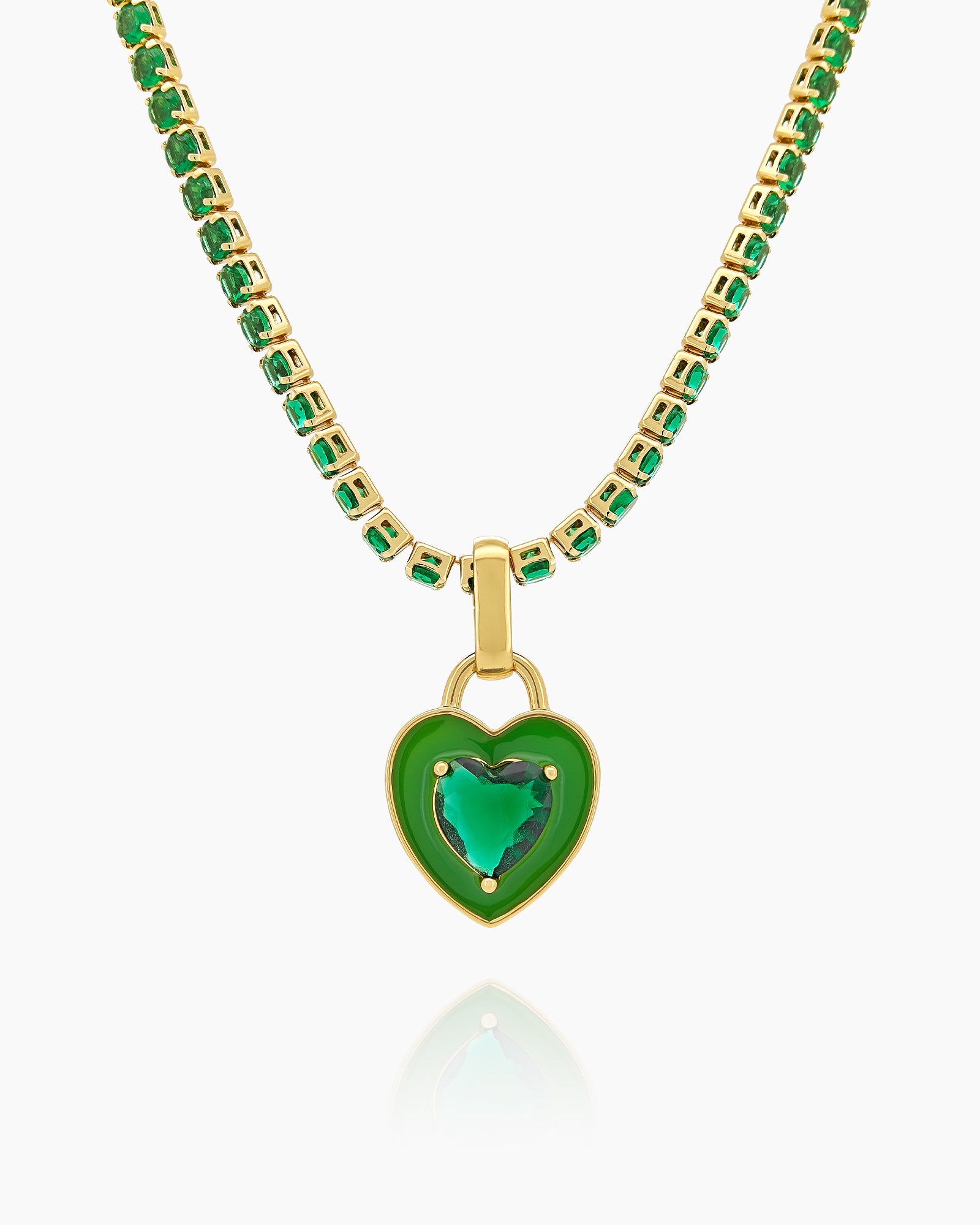 A green tennis necklace with a full strand of zircon stones and an enamel heart charm with a center stone