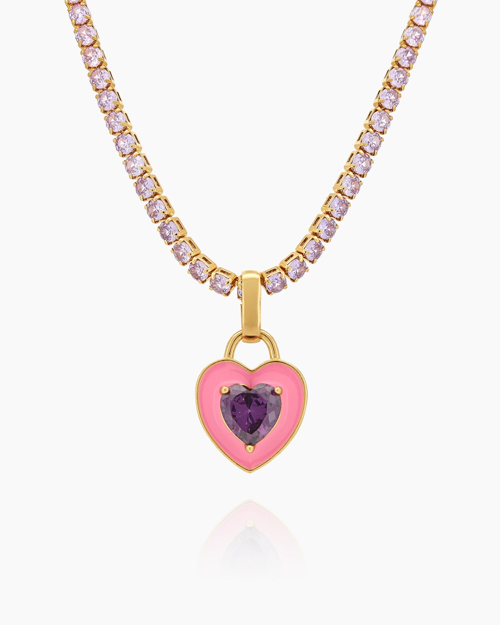 A light-pink tennis necklace with a full strand of zircon stones and an enamel heart charm with a center stone