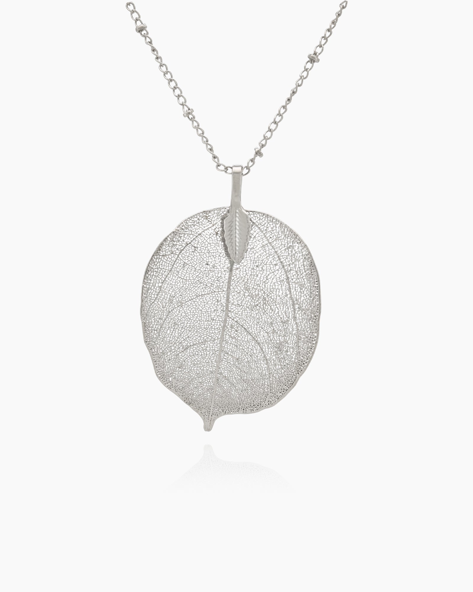 A silver necklace with a delicate leaf pendant featuring intricate vein patterns on a slim, textured chain