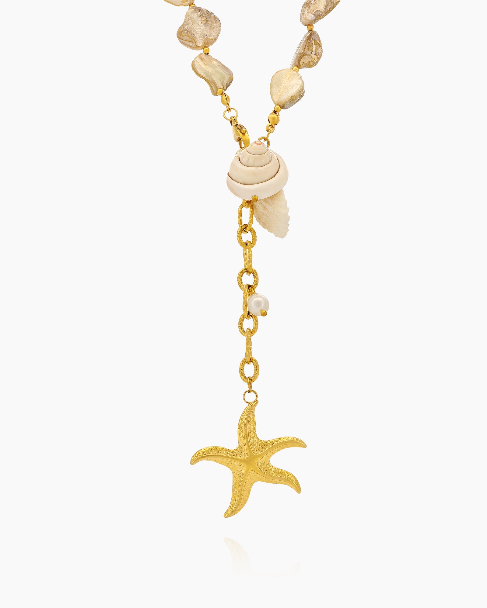 A necklace of irregular freshwater shell beads and luminous pearls with golden shell and starfish charms