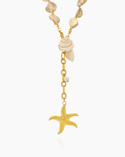 A necklace of irregular freshwater shell beads and luminous pearls with golden shell and starfish charms