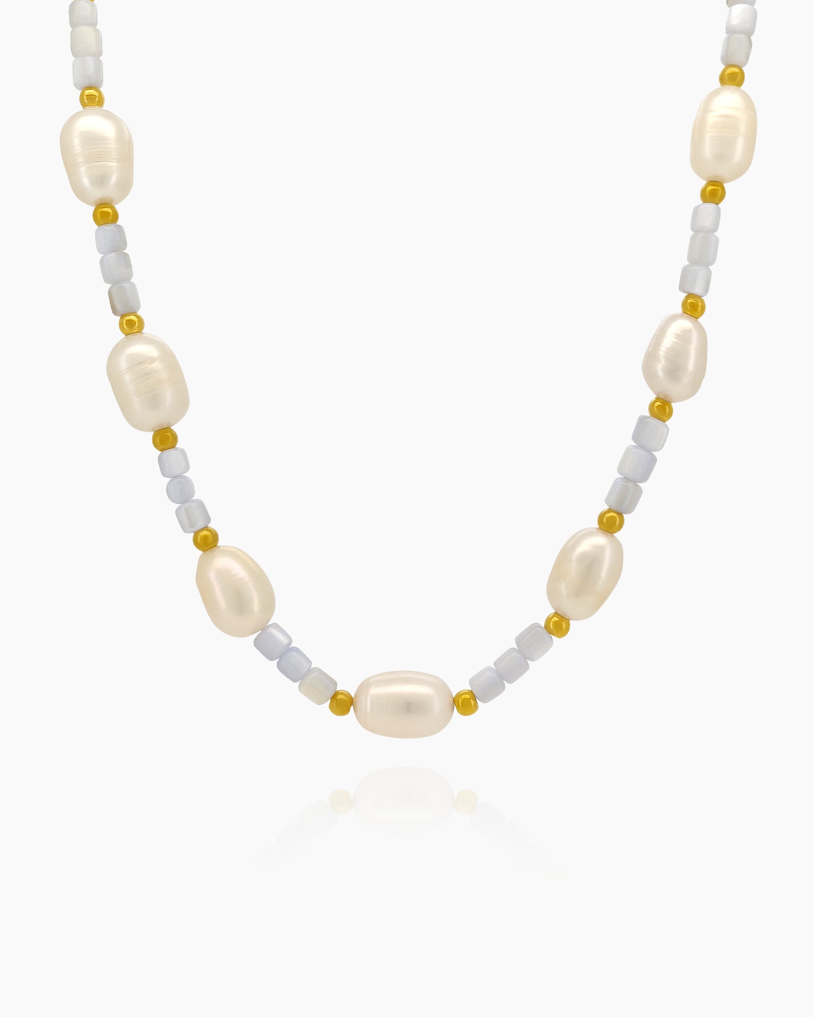 A beaded necklace of light blue agate beads dotted with luminous freshwater pearls and tiny gold accents