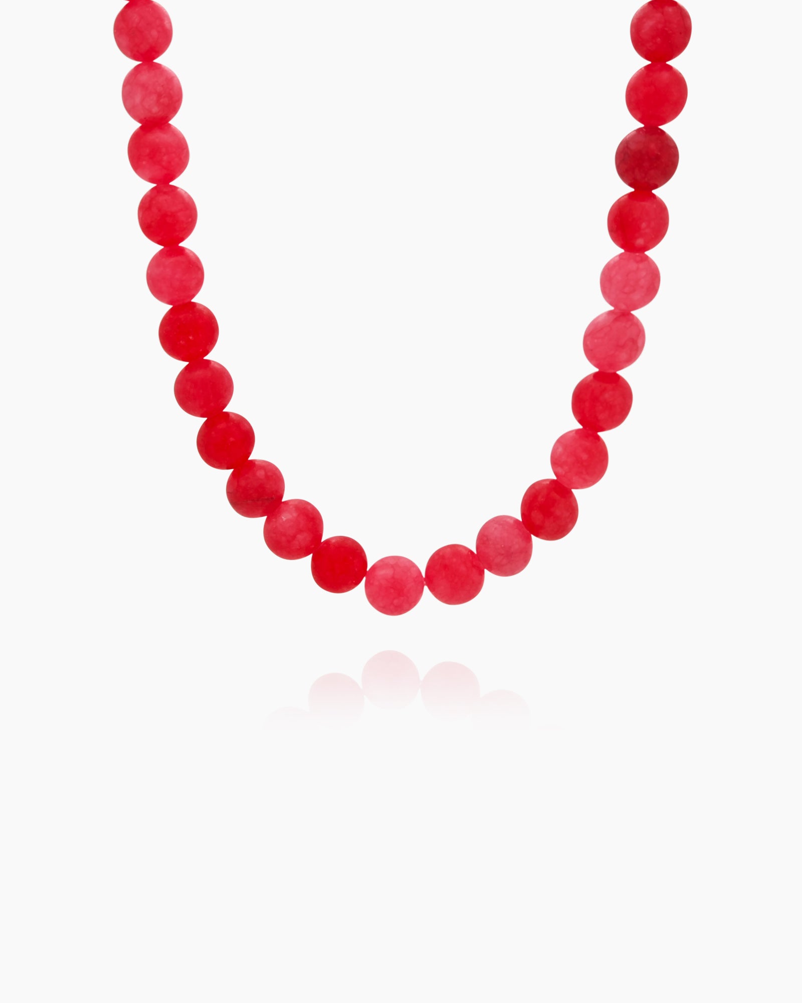 A timeless necklace with a strand of polished coral beads in rich raspberry-red tones for a bold look