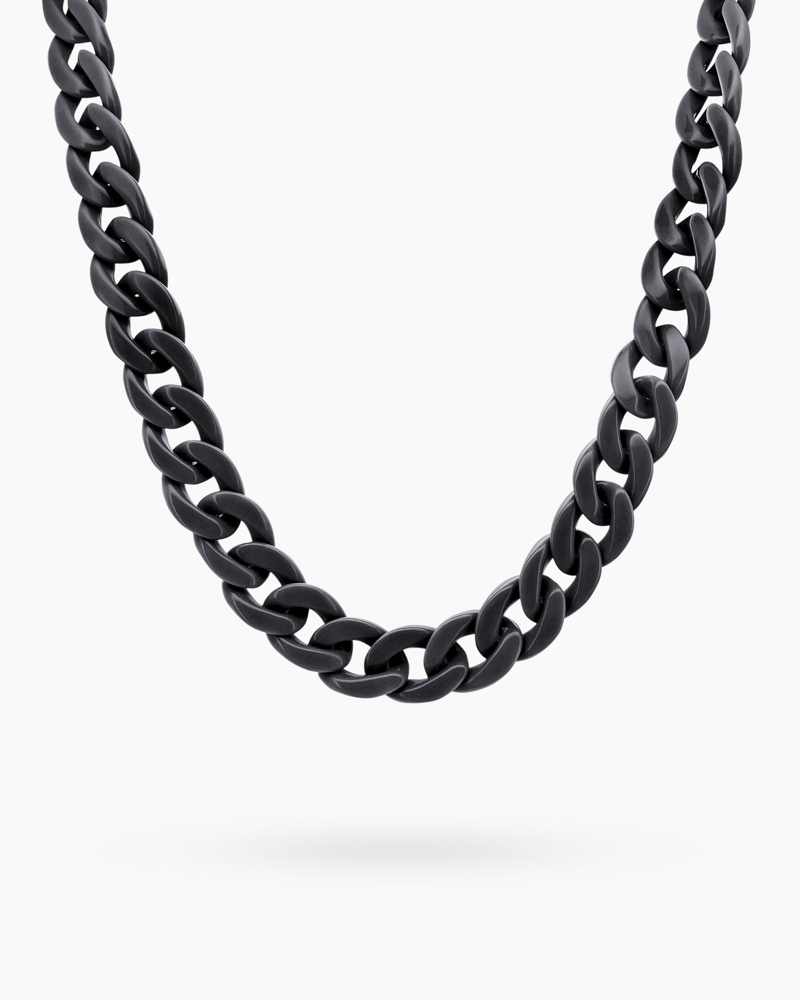 A glasses chain in black with oversized, glossy color links for a playful and practical statement