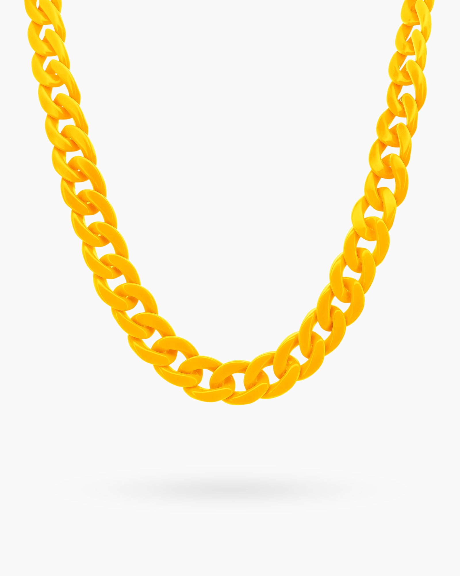 A glasses chain in yellow with oversized, glossy color links for a playful and practical statement