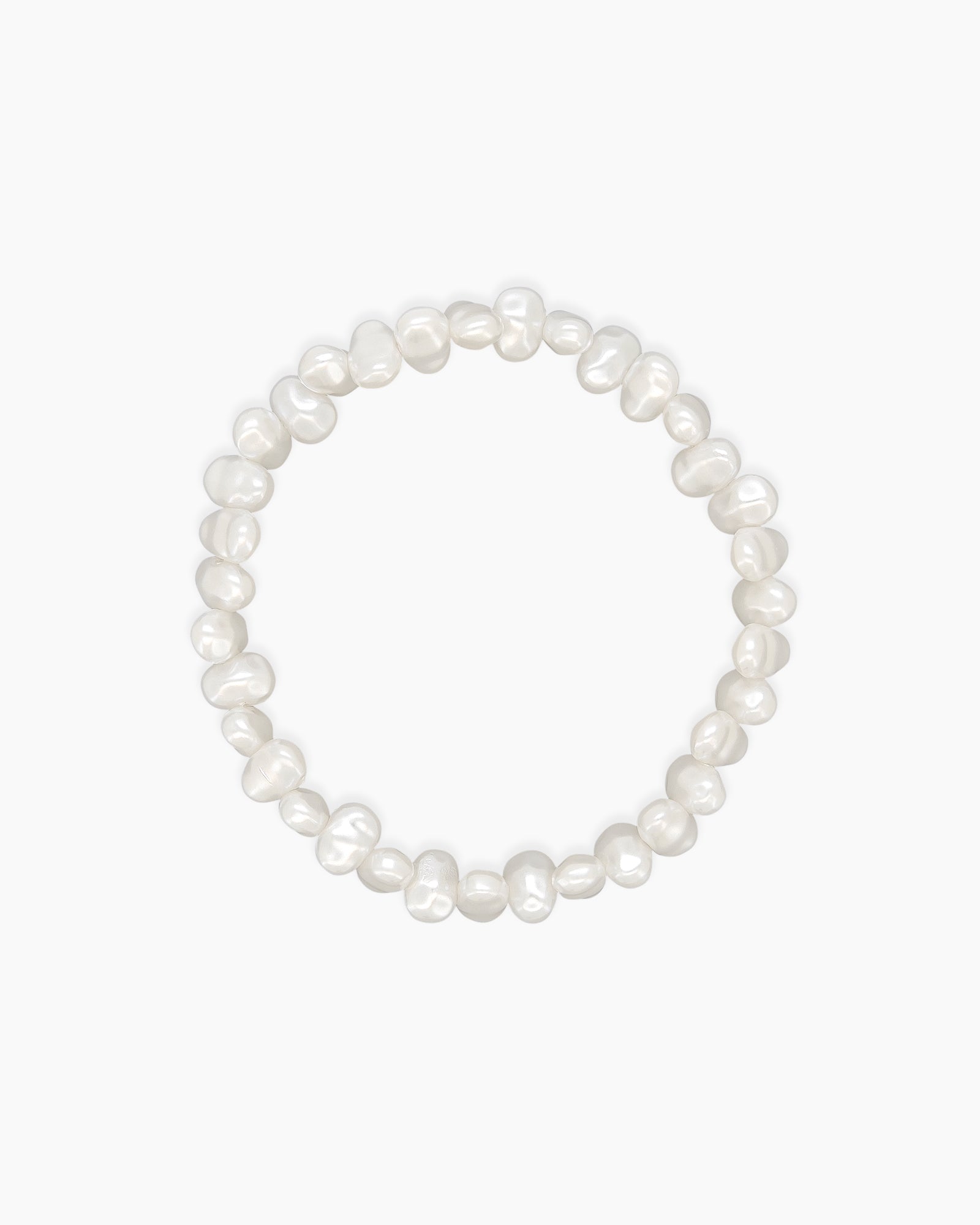 A stretch-fit bracelet with faux pearls in organic, softly irregular shapes for an elegant touch
