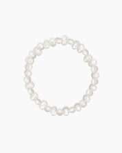 A stretch-fit bracelet with faux pearls in organic, softly irregular shapes for an elegant touch