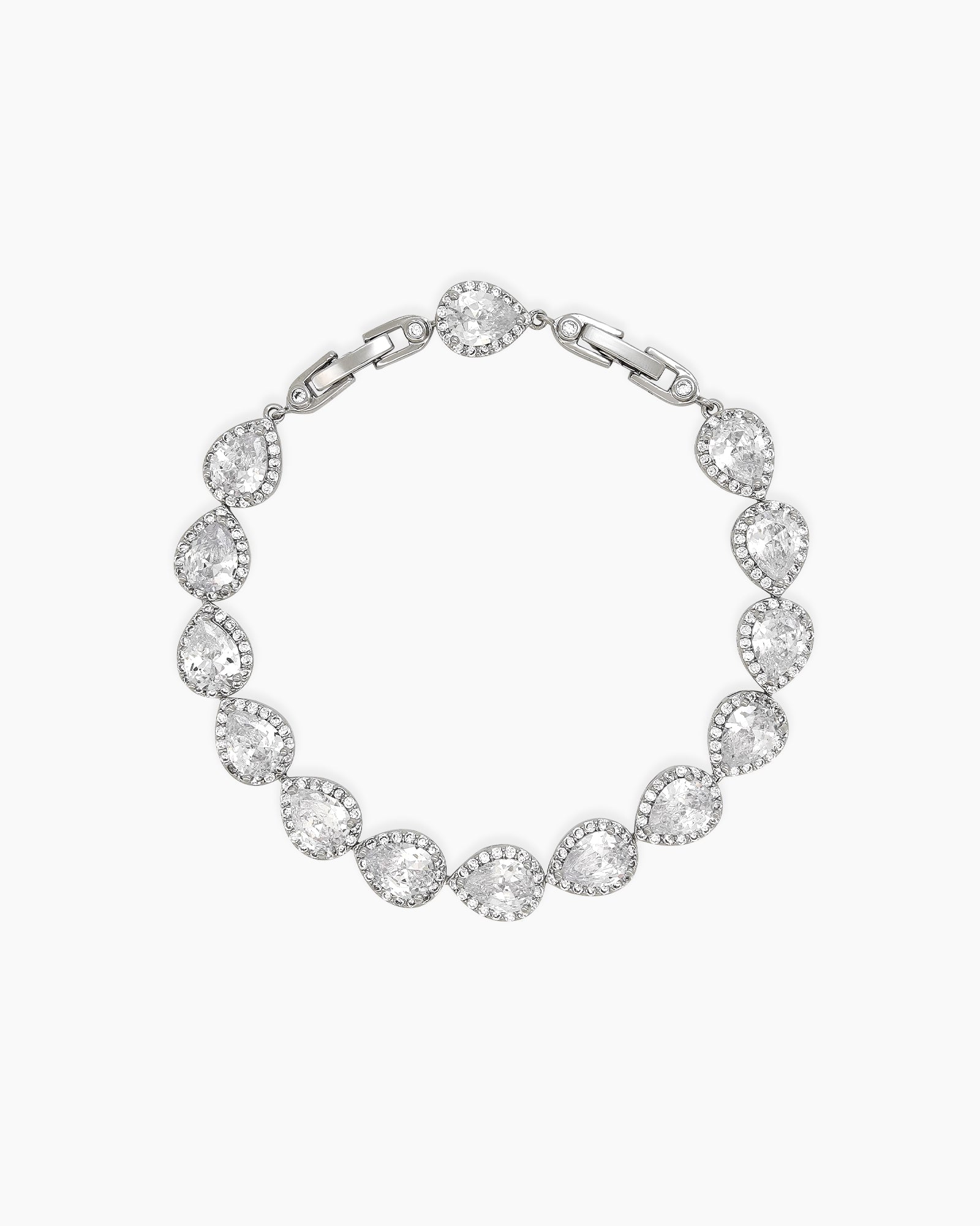A bracelet with a fluid line of teardrop-cut zircon stones, each haloed in a sparkling pavé setting