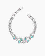 A radiant lake-blue vintage-style bracelet with two rows of zircons and five haloed heart-shaped centerpieces