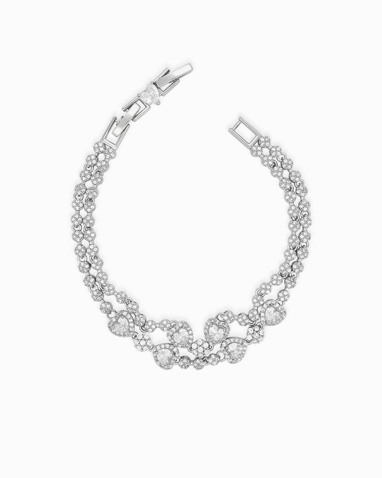 A radiant white vintage-style bracelet with two rows of zircons and five haloed heart-shaped centerpieces