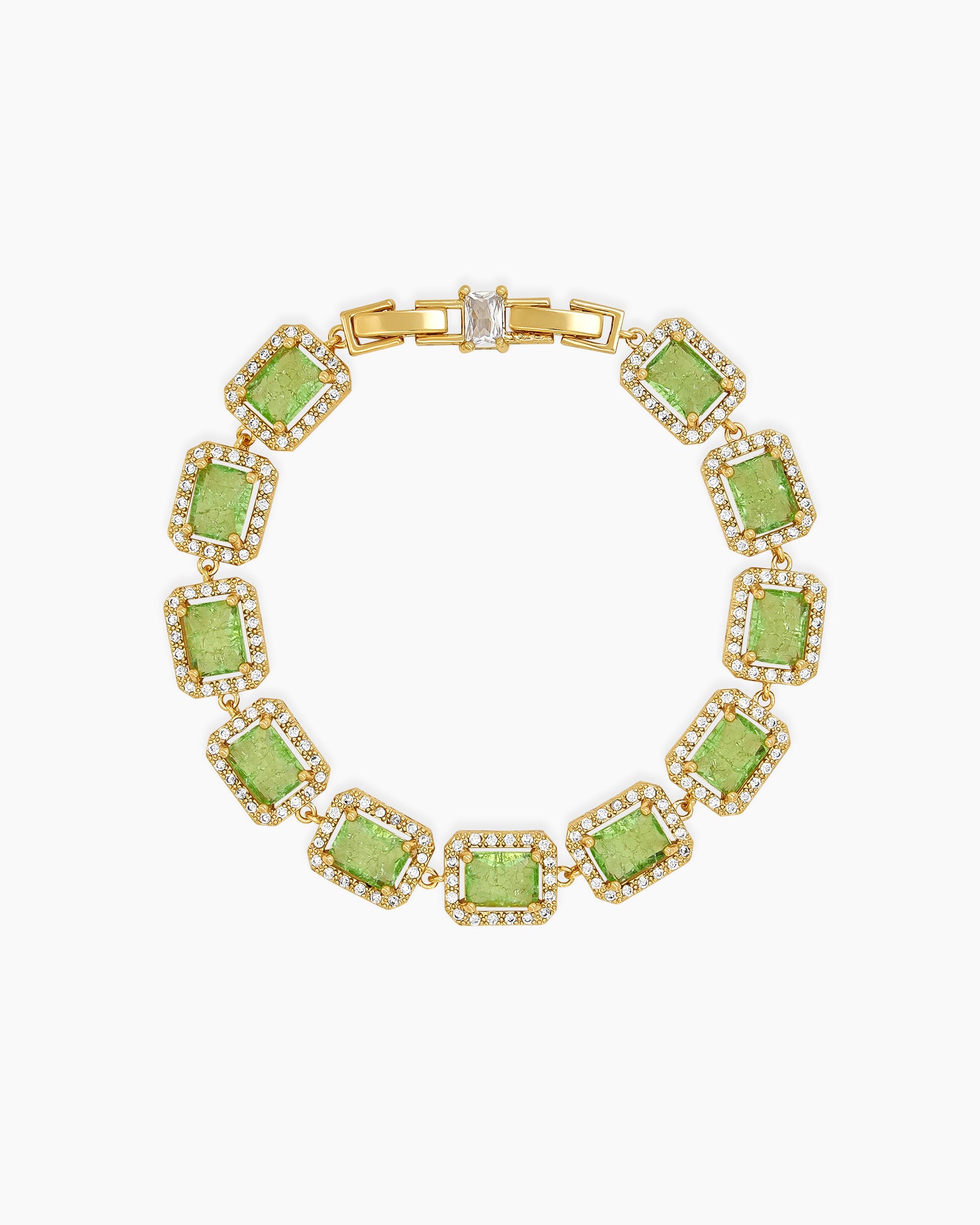 A green bracelet with emerald-cut stones framed by a halo of pavé-set zircons, exuding vintage glamour