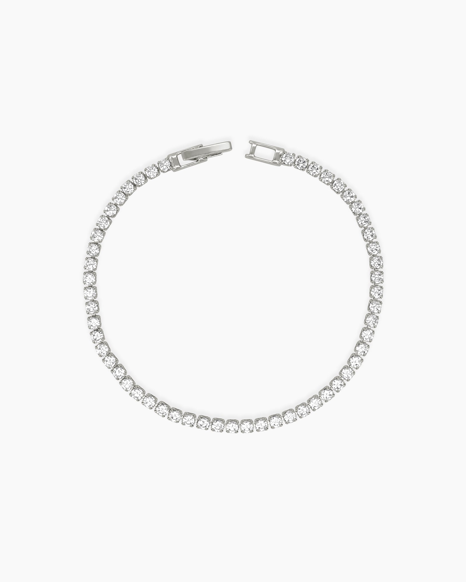 A sophisticated platinum tennis bracelet with a single row of 2.5mm brilliant-cut zircon stones