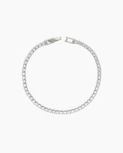 A sophisticated platinum tennis bracelet with a single row of 2.5mm brilliant-cut zircon stones