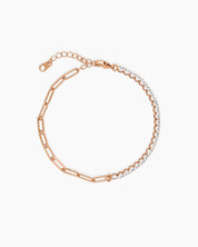 A rose-gold bracelet uniting a modern paperclip chain with the timeless elegance of a classic tennis setting
