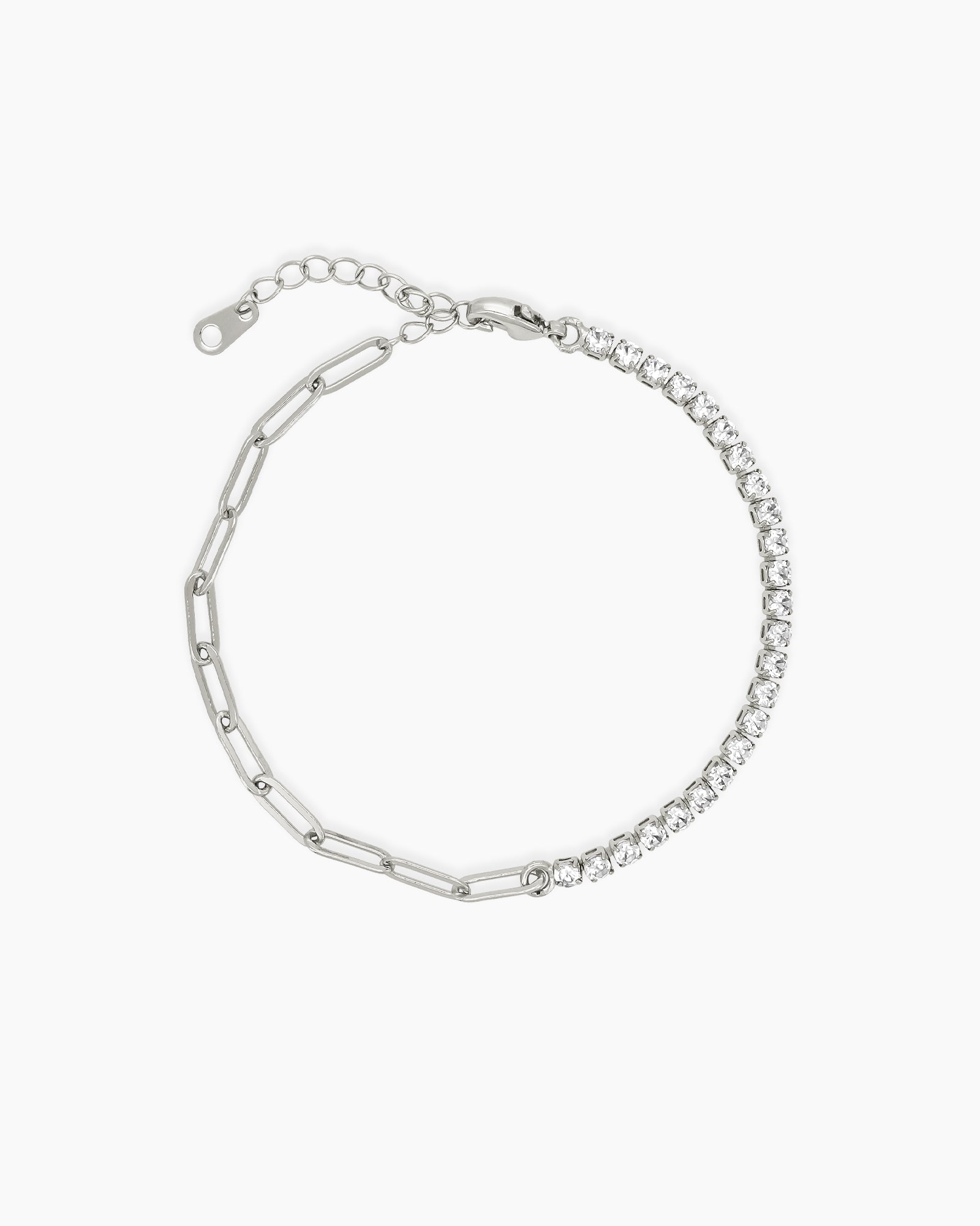 A silver bracelet uniting a modern paperclip chain with the timeless elegance of a classic tennis setting