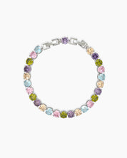 A tennis bracelet with a cheerful array of round-cut zircons in soft pastel shades and a sleek silver frame