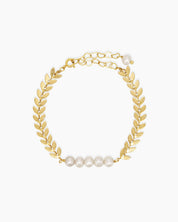 A bracelet of textured laurel leaves and luminous freshwater pearls for a look of classical beauty