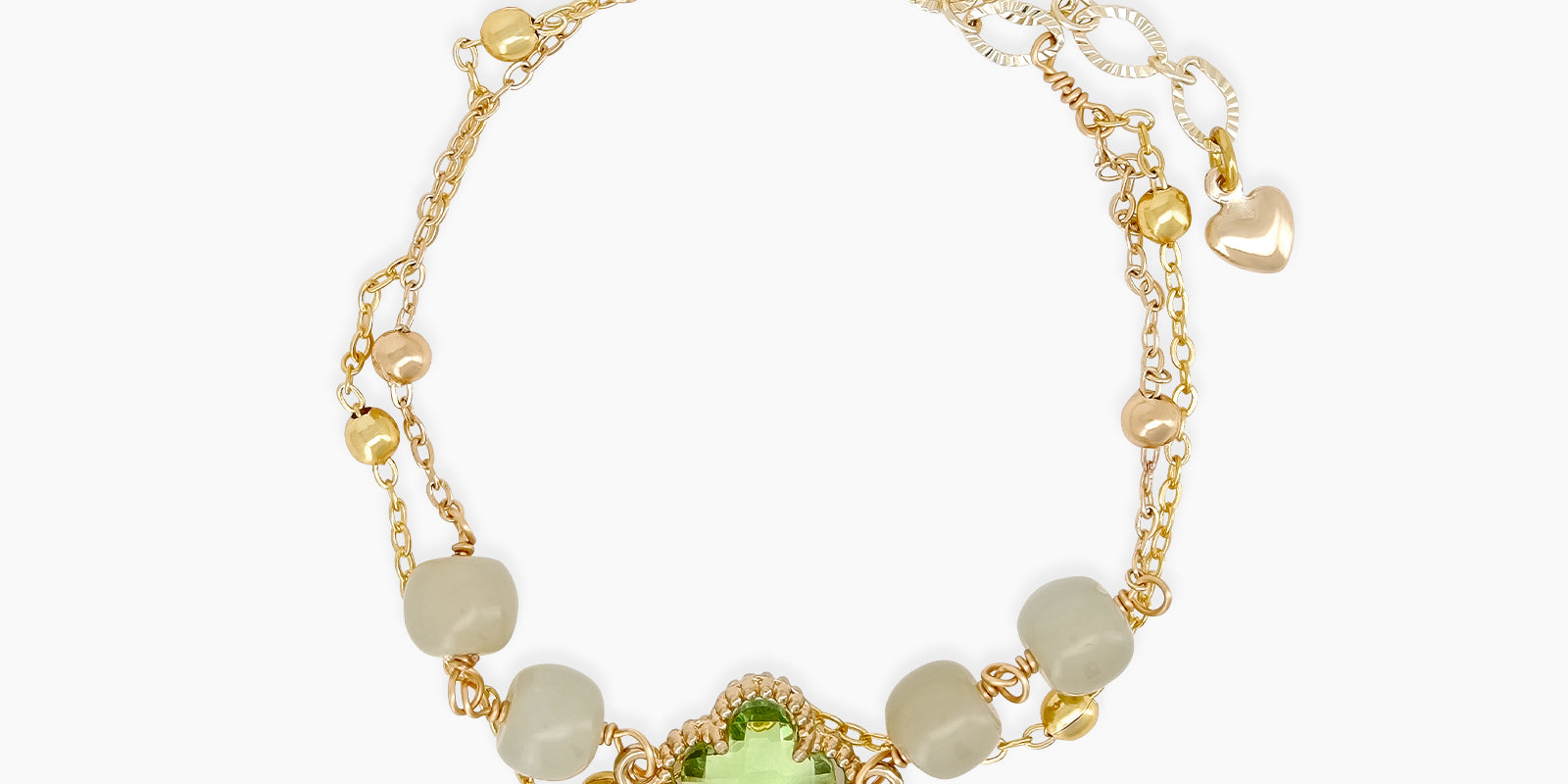 A bracelet with a green clover-like jade stone at its heart, with soft jade beads and golden accents