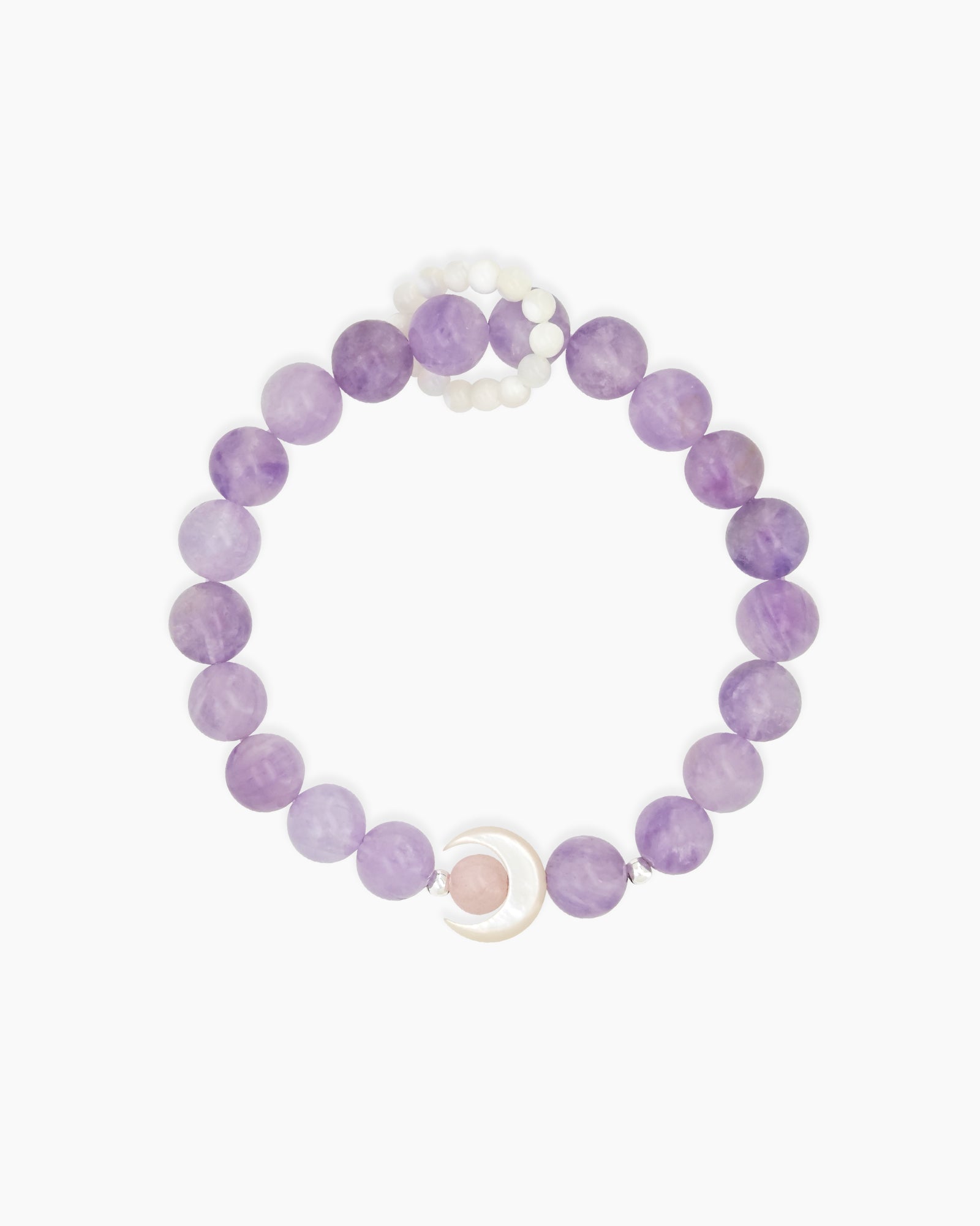 A bracelet of lavender crystal beads with a mother-of-pearl crescent charm cradling a soft rose crystal