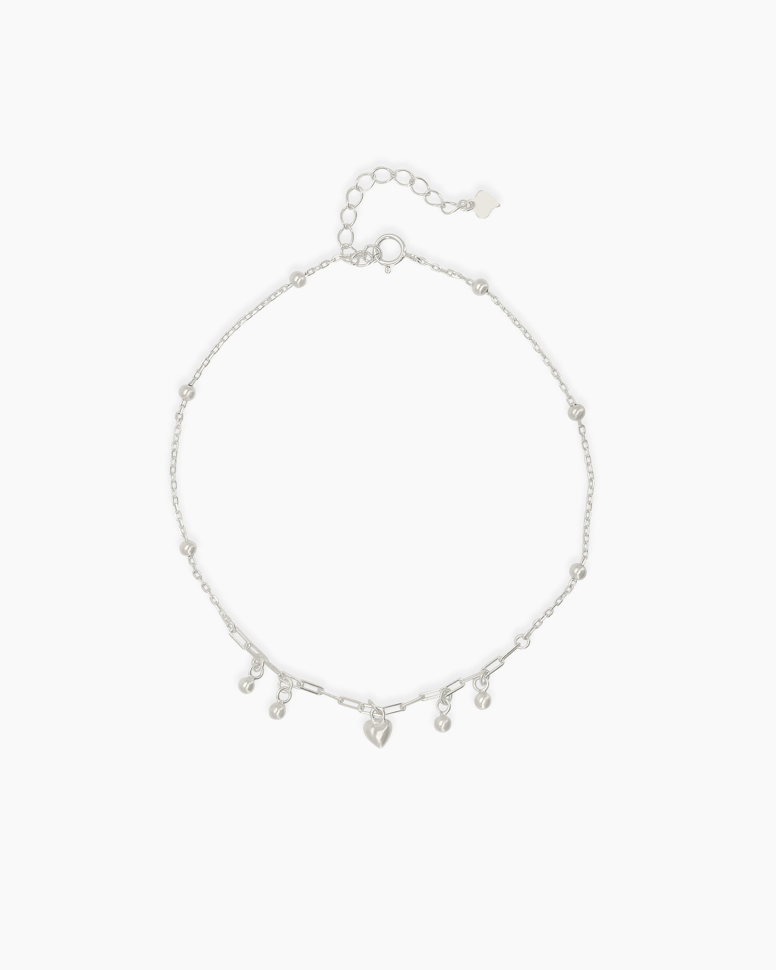 An adjustable 925 sterling silver anklet with a delicate chain, polished beads, and mini charms