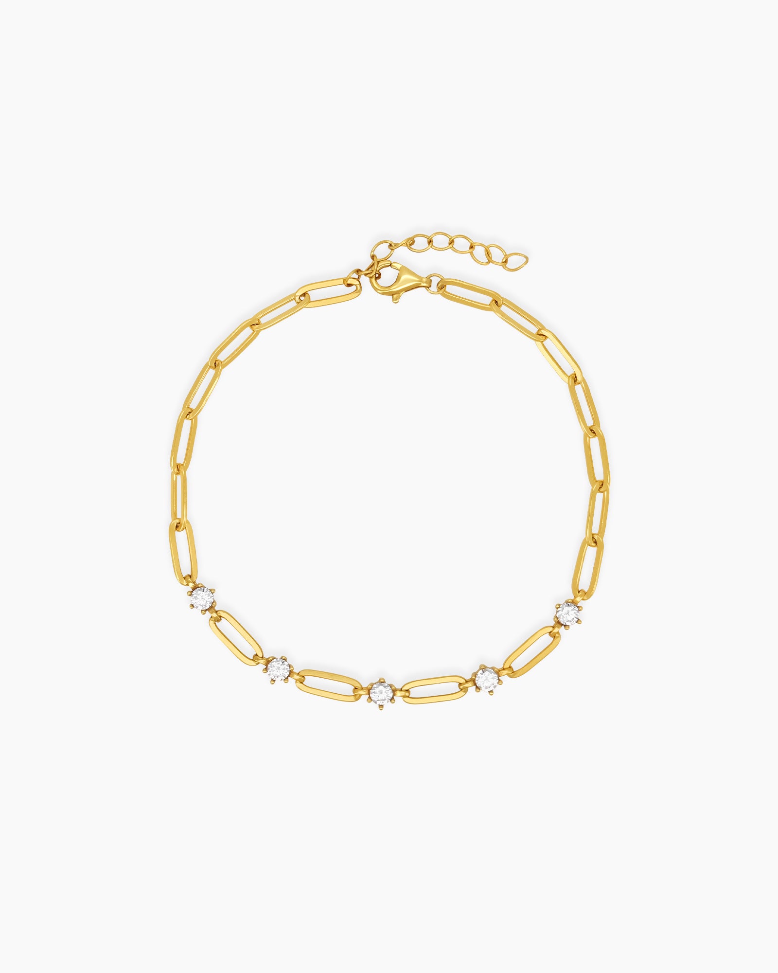 A bracelet with a sleek gold-tone paperclip chain punctuated with brilliant, prong-set cubic zirconia