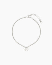 A minimalist bracelet with a shimmering diamond-cut silver chain finished with a dainty zircon bow