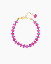 A bracelet with a striking palette of glossy pink quartz beads and turquoise spacers for a bold contrast
