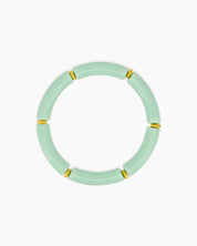 A playful ocean bangle with smooth, curved acrylic segments and delicate golden connectors