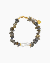 A bracelet of natural gray quartz chips, anchored by a luminous baroque pearl at its center
